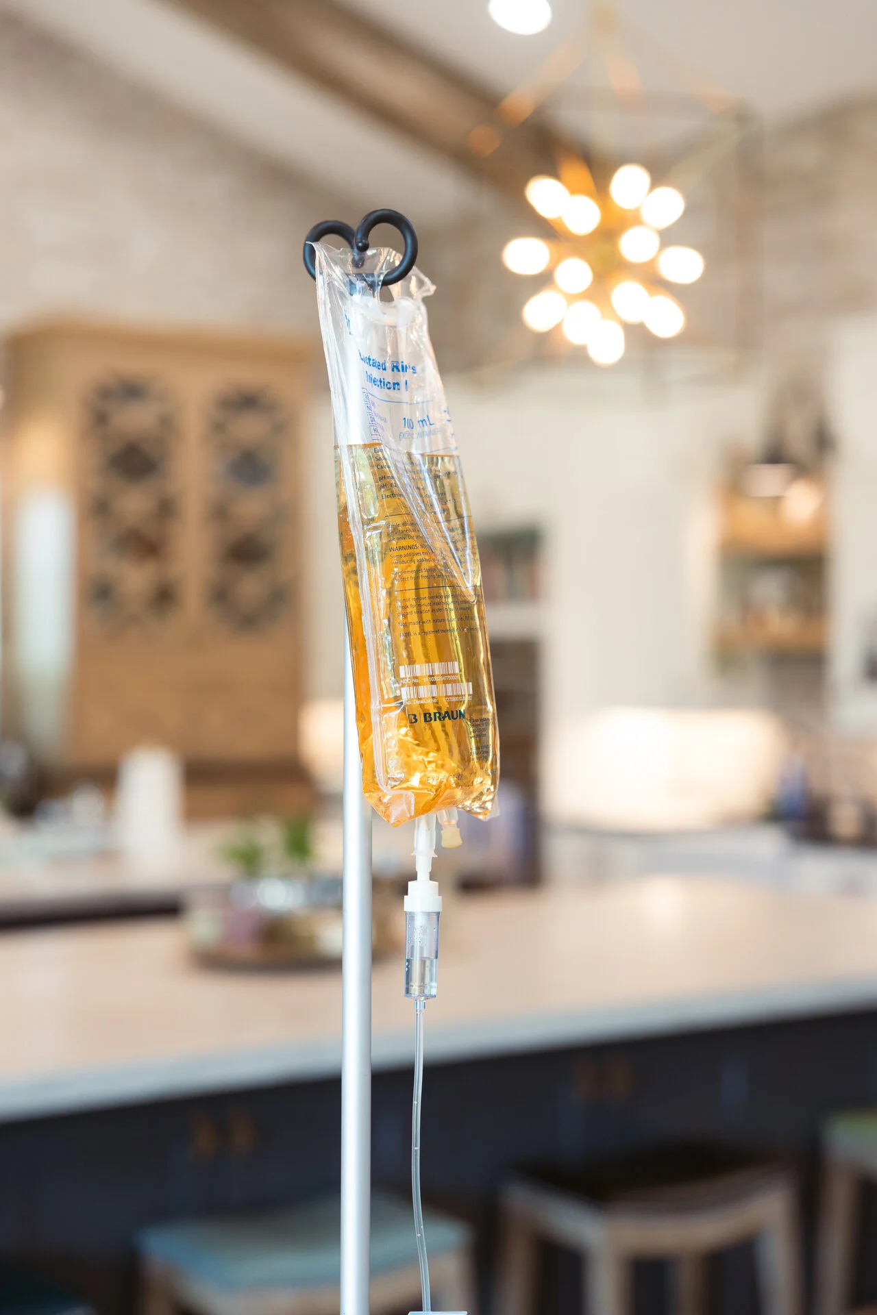 IV Revival nurse administering cold and flu IV therapy at Phoenix home