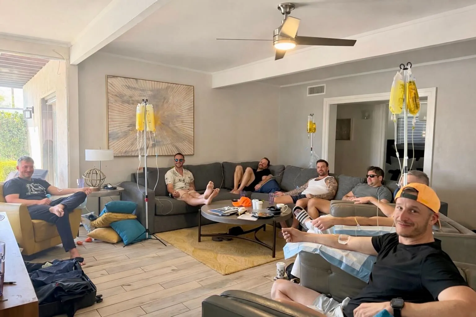 Group of friends recovering with hangover IV therapy in Scottsdale living room